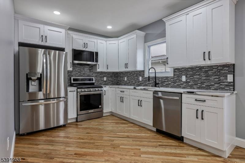 Beautifully updated single family home in Garfield with 4 bedrooms and 2.