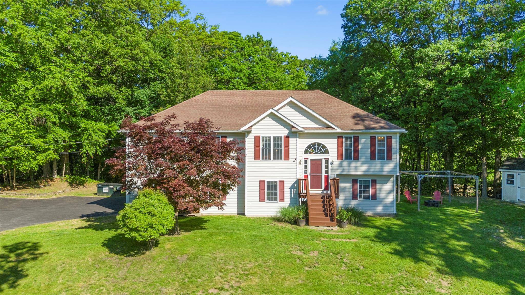 Welcome to 42 Bell Drive, a beautifully sited, oversized Raised Ranch nestled in the magical hamlet of Highland.