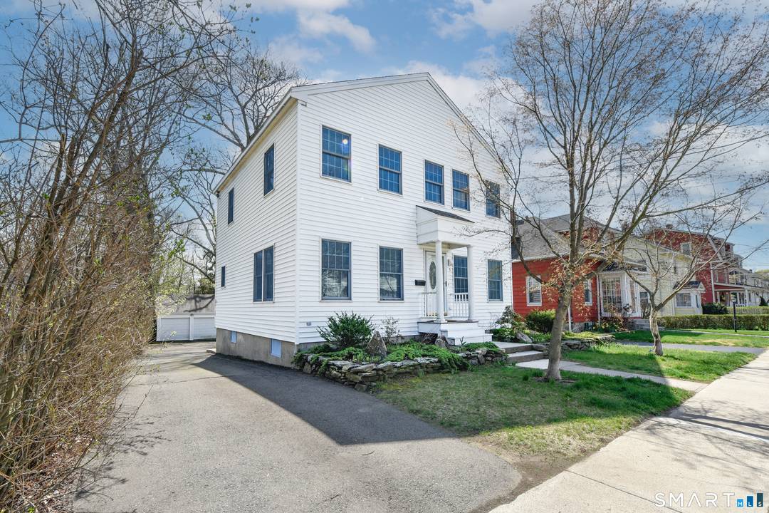 Welcome to this beautifully maintained three bedroom, two full bath, one half bath home offering three levels of spacious living.