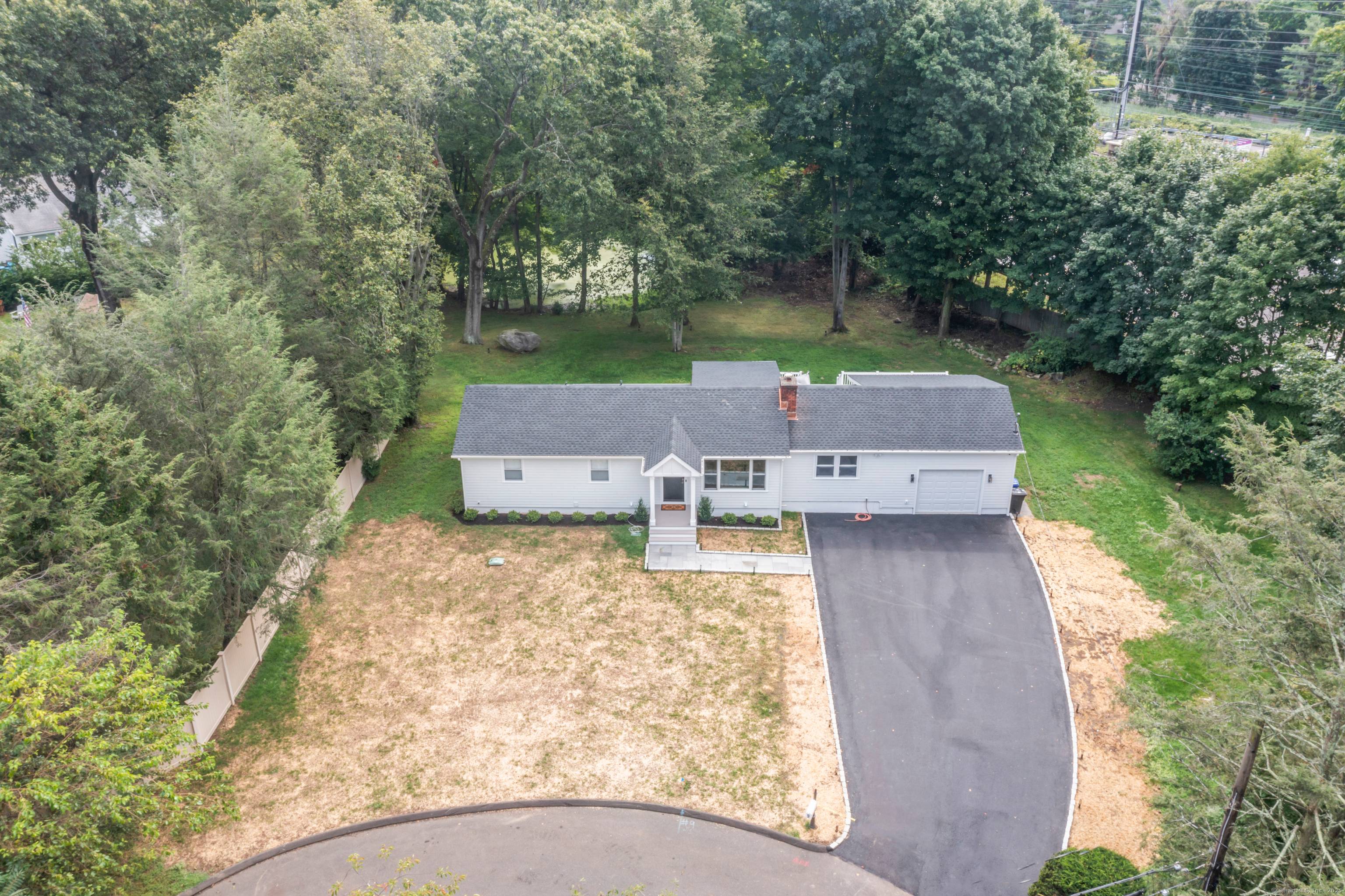 Welcome to a refined Elegance Nestled at the end of a cul de sac in Norwalk, the Village of Rowayton.