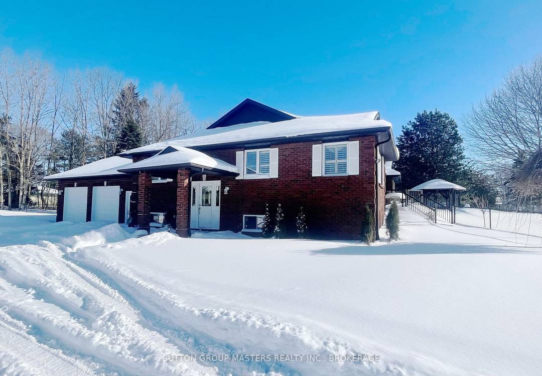 WATERFRONT LOCATION ! A rare opportunity to own an exceptional brick bungalow on a level 2.