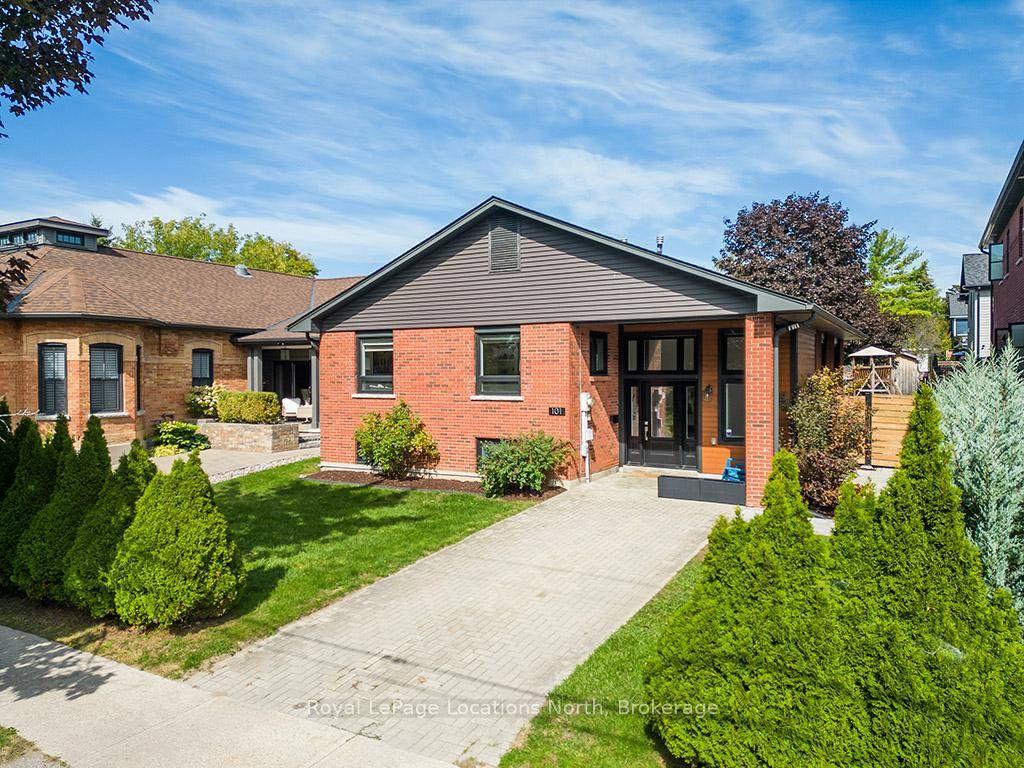 Classic red brick raised bungalow, perfectly situated on a quiet, tree lined street located in Downtown Collingwood.