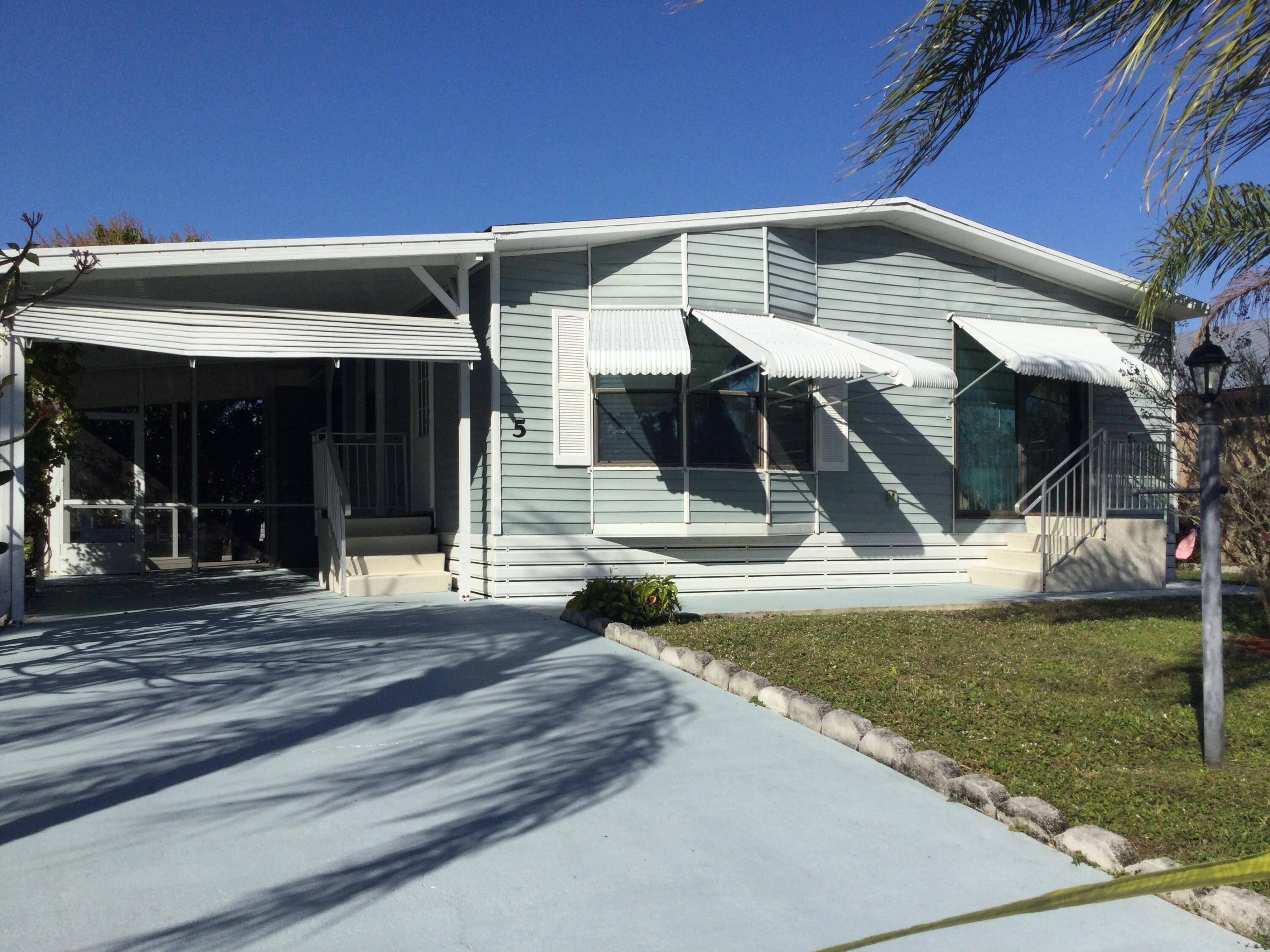 This open concept home features an updated kitchen baths with new granite in both and laminate flooring throughout.