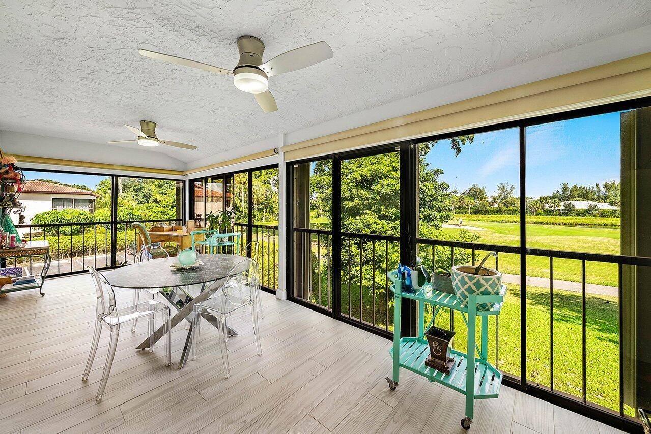 Enjoy beautiful golf course views from this bright and airy second floor corner residence overlooking the third hole of the Boca Lago Golf Course.