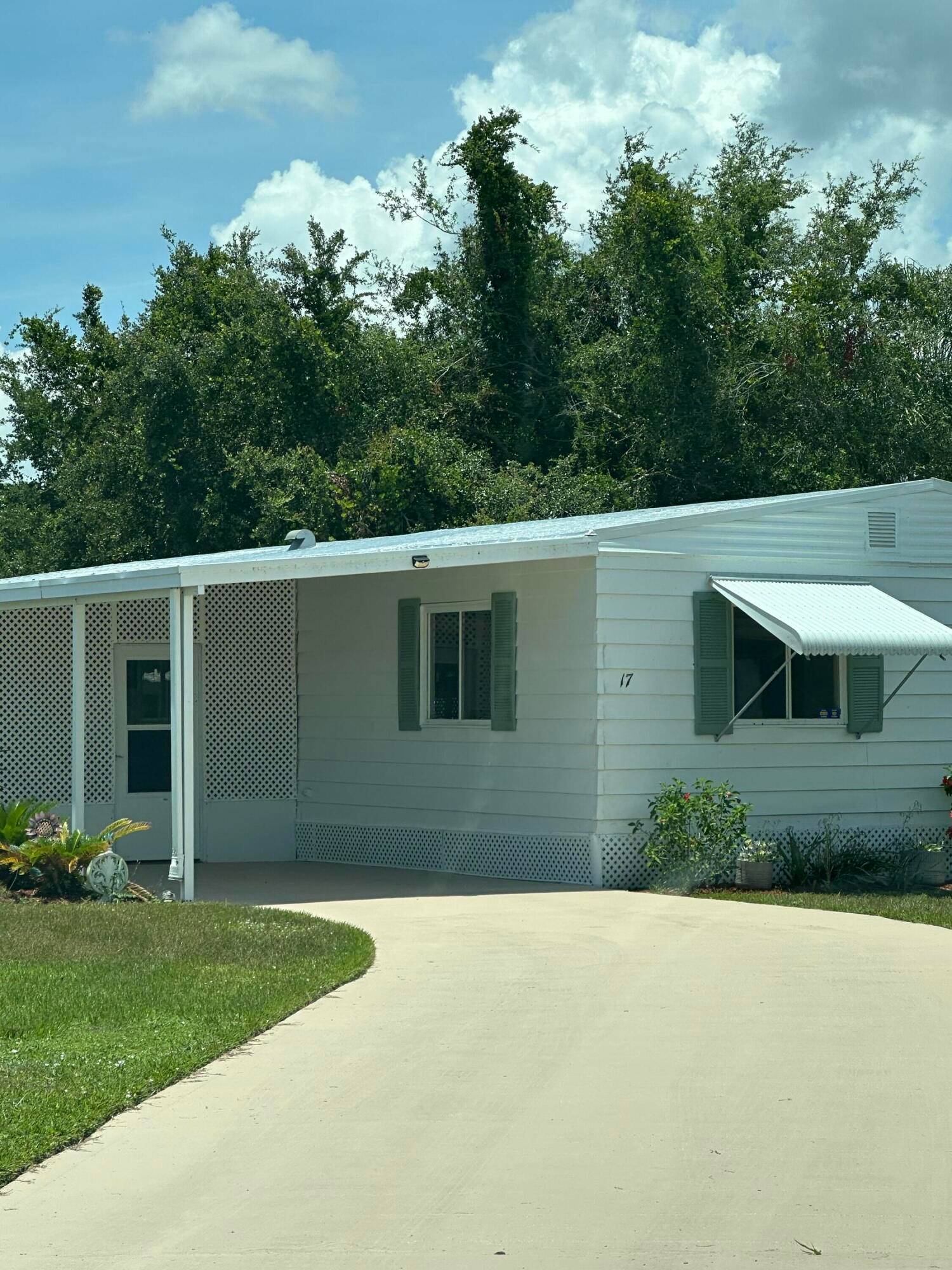 Large Lake View home with inside laundry, two dining areas, Huge living room, Florida room as well as a screened patio, Extra large shed in the back of the home, ...
