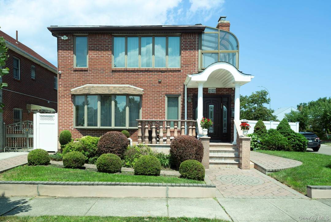 Welcome to an updated and meticulously maintained, sun drenched brick Colonial in the heart of Fresh Meadows on a beautifully landscaped corner lot.