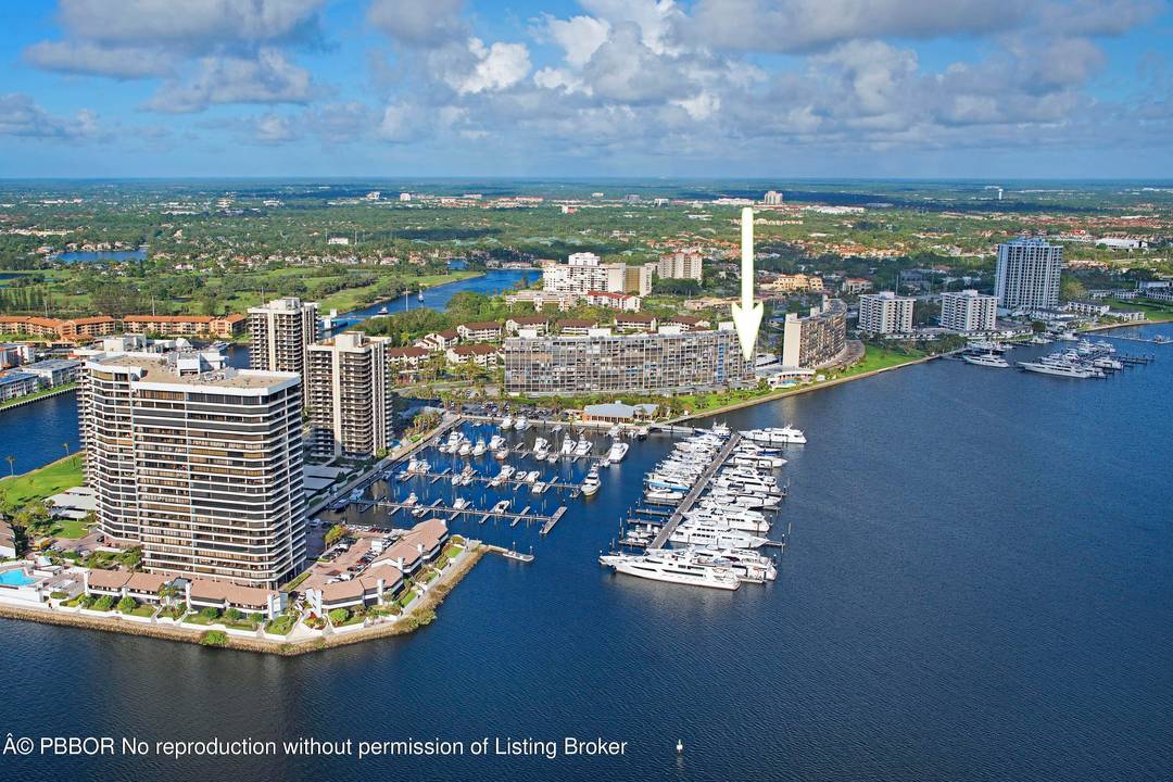 Direct east 2BR 2BA apartment in sought after Old Port Cove with beautiful lake and marina views.