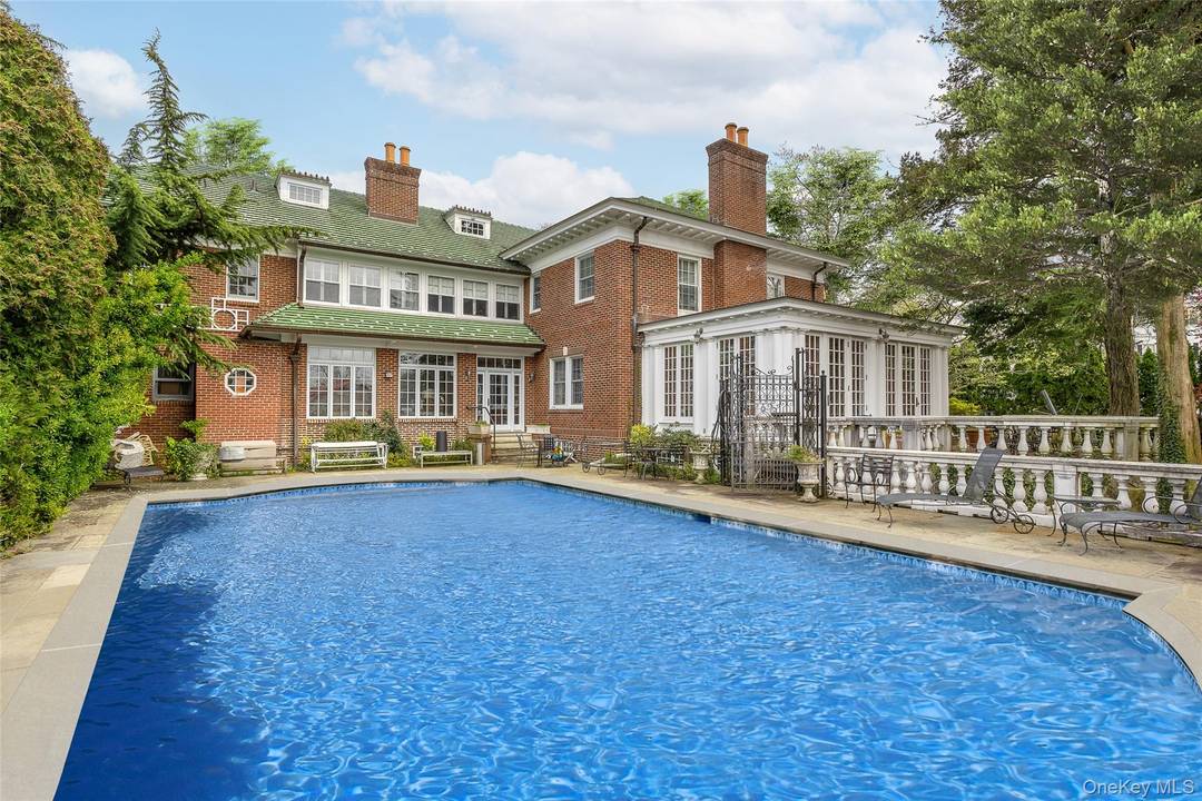 Discover the grandeur of Colonial Revival, a stately historic mansion set in the prestigious Douglaston Manor Historic District, nestled on two lots.