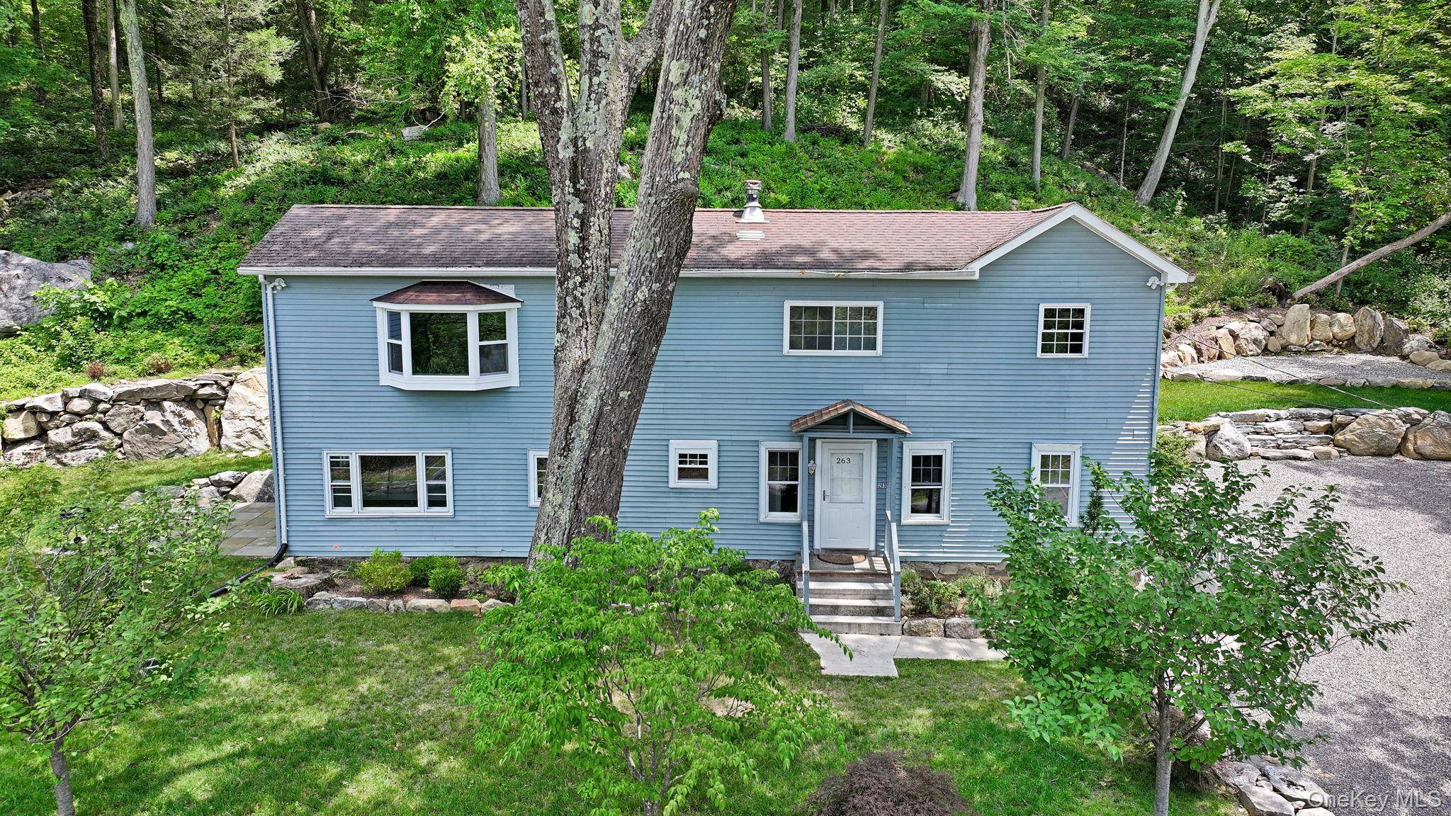 Welcome to this beautifully renovated 4 bedroom, 3 bath Colonial style home nestled on 2.