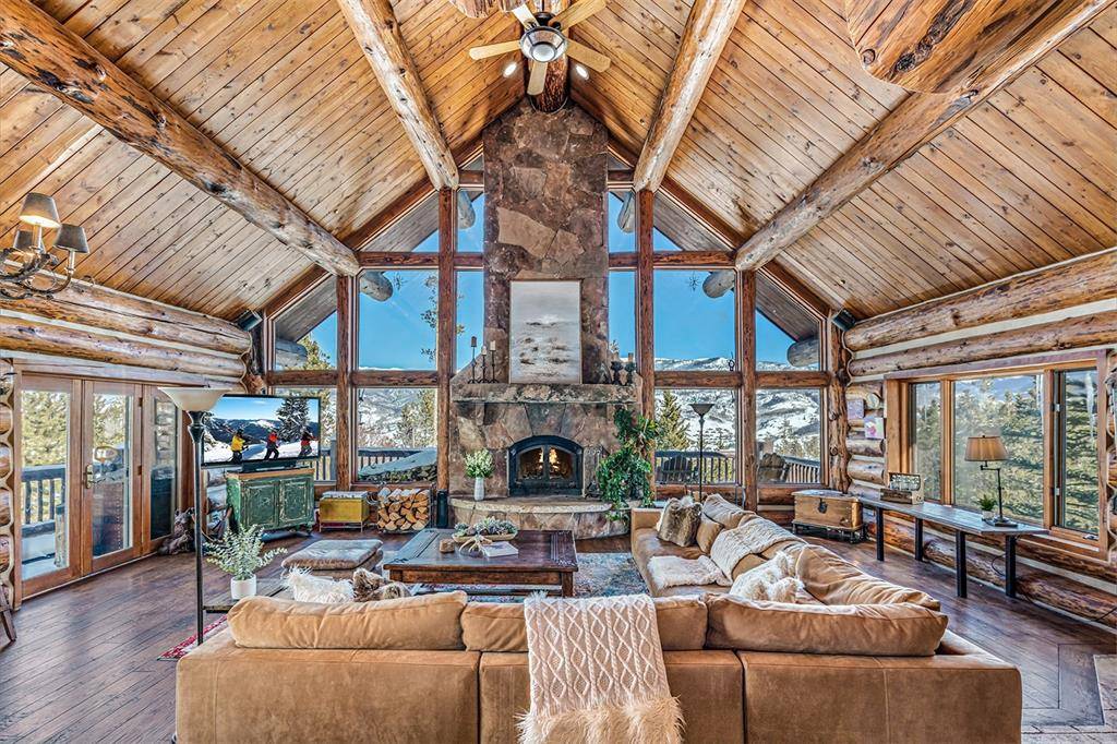 With stunning 360 degrees mountain views from soaring windows and expansive decks, this immaculately renovated and expanded 8 bedroom 7.