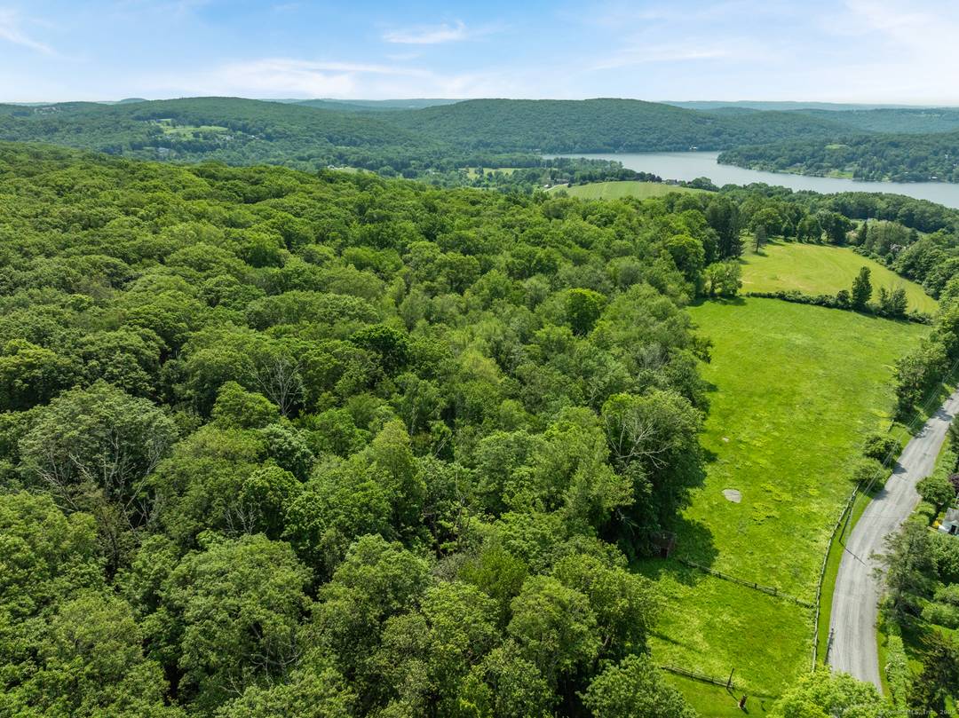 68 acres consisting of two lots in the hills above Lake Waramaug with potential for long views and a glimpse of the lake.
