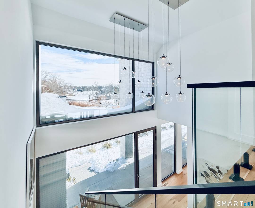 Designed by custom home builder Vita Design, this exciting newly constructed modern residence is a refined architectural statement that balances scale and light, capturing direct 5 Mile River views and ...