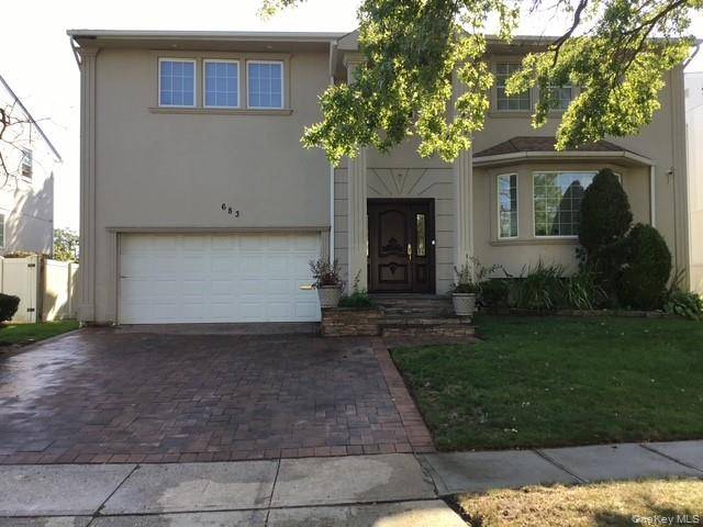 Prime property tucked away in the exclusive area of North Woodmere, features Large living room, formal dining room, EIK with pantry and a powder room, Den with fireplace and a ...