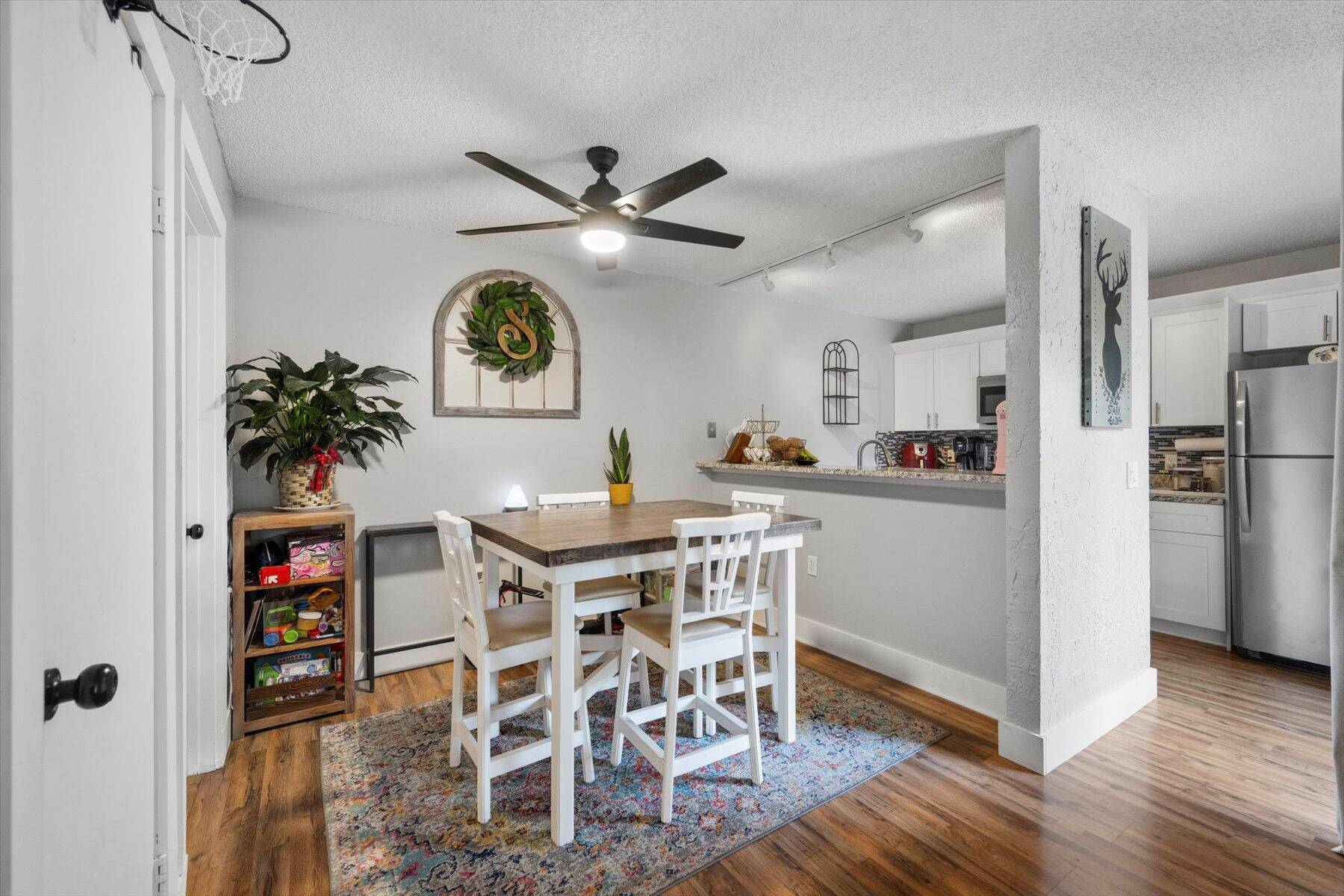 Welcome In To This Beautifully Remodeled Townhome w Updated White Shaker Soft Close Kitchen Cabinets w Crown Molding.