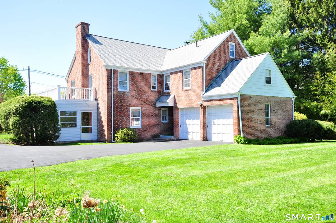 Wonderful stately brick center hall colonial !