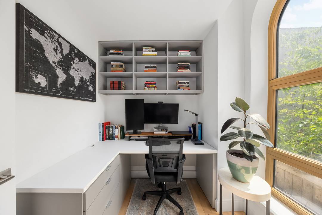 This one bedroom residence exudes a sense of home with its spacious layout and bright custom built home office, perfect for remote work or personal projects.