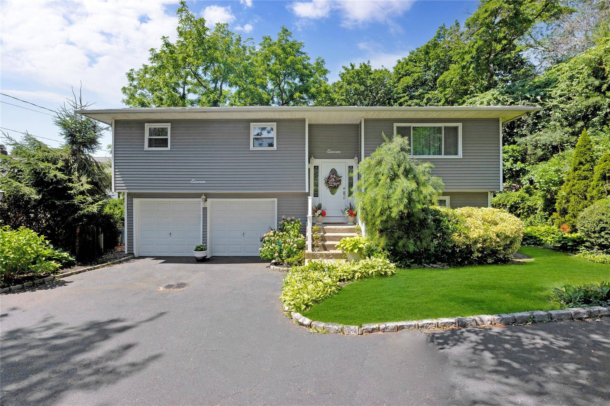 Welcome to 11 Margaret Lane a beautifully maintained high ranch located in the heart of Huntington, where charm meets convenience.