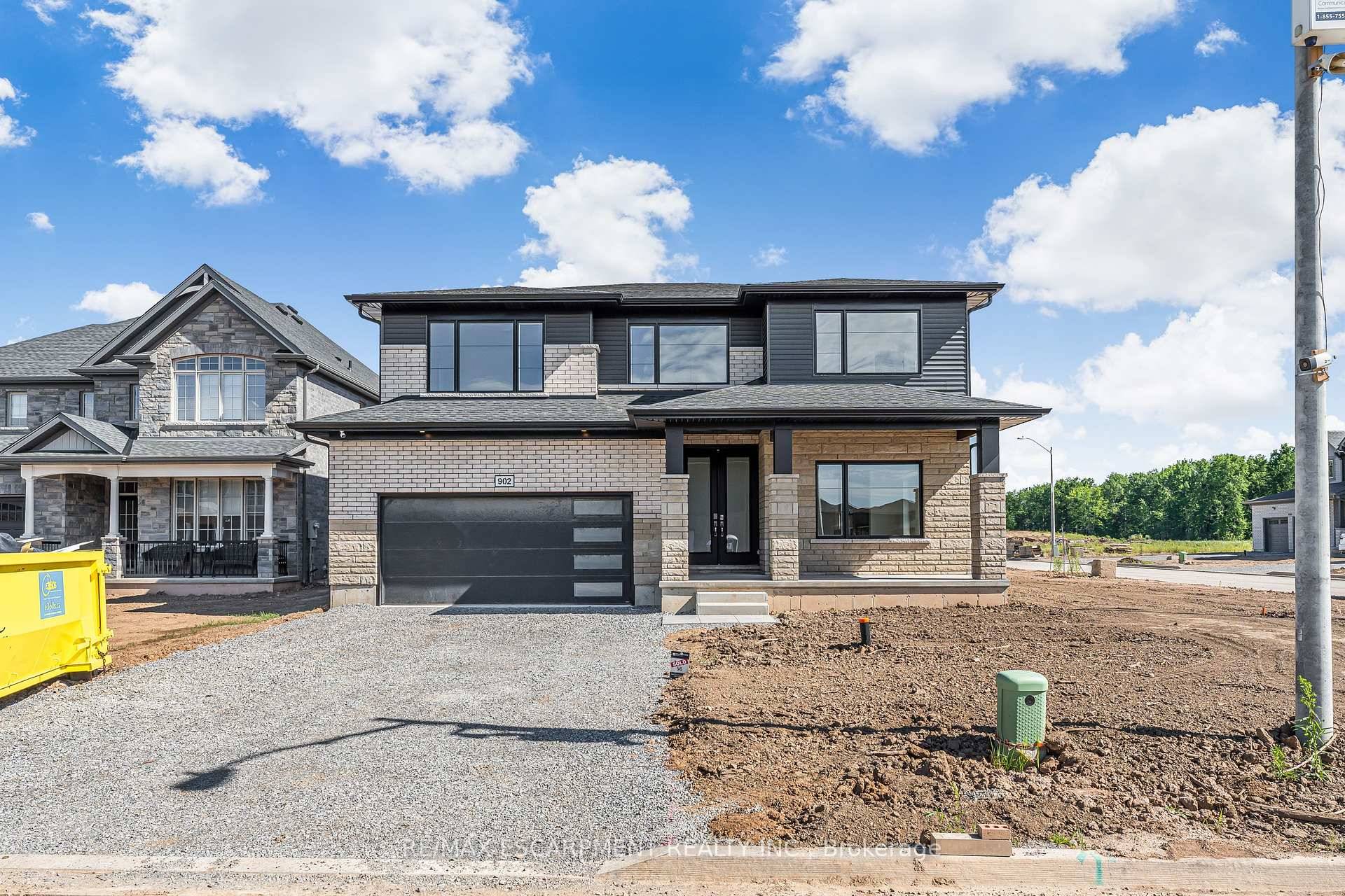 Welcome to 902 Rutherford Ave, a 5 bedroom, 4 bathroom detached 2 storey home situated on a large corner lot and offering 3, 165 sq.