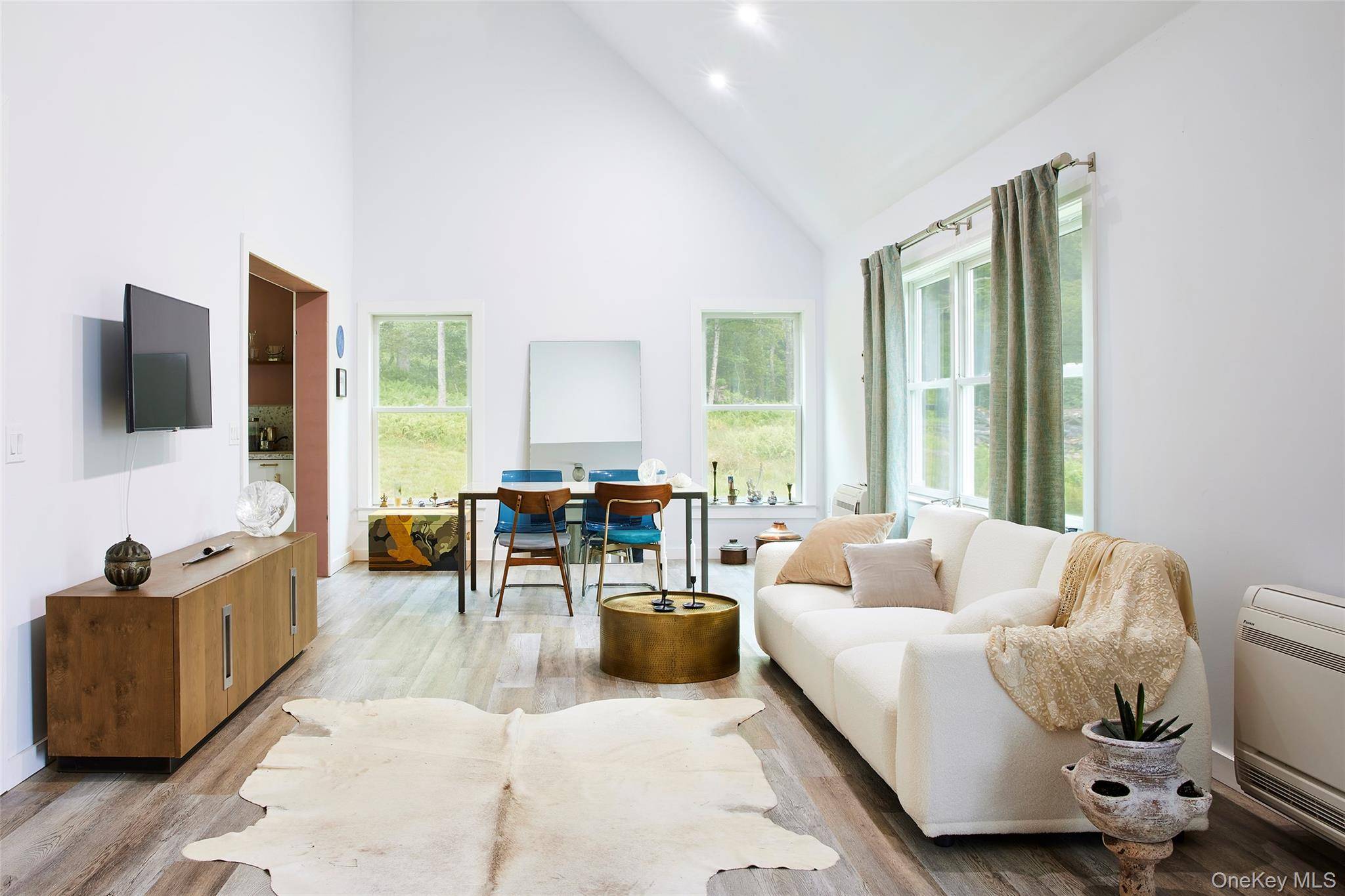 Atop a wooded hillside, on a peaceful country road just fifteen minutes from Livingston Manor s bustling Main Street, sits this charming Catskills cottage.