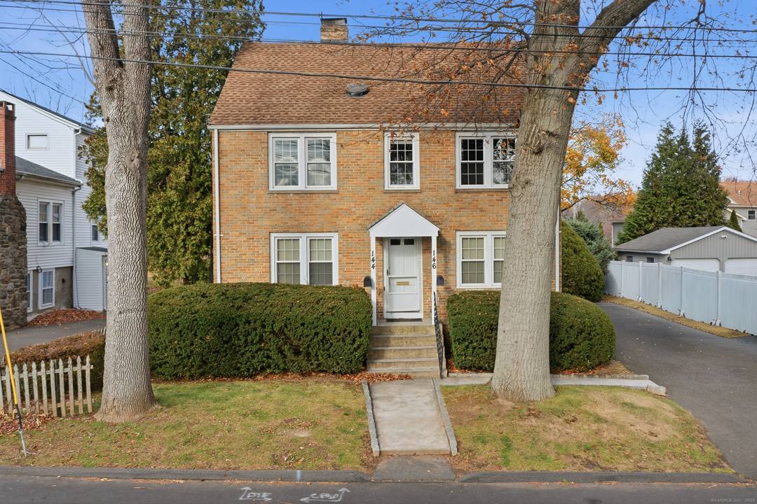 Discover this well preserved brick multi family home, built in 1941, offering timeless appeal and versatile living options on a spacious level double lot.