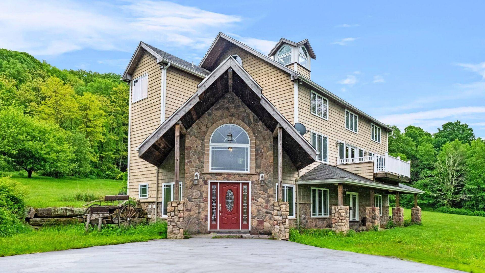 Nestled in Dutchess County, this one of a kind 1780s cattle barn, reimagined as a stunning modern residence, awaits its next occupant to cherish its historic charm and unique character.