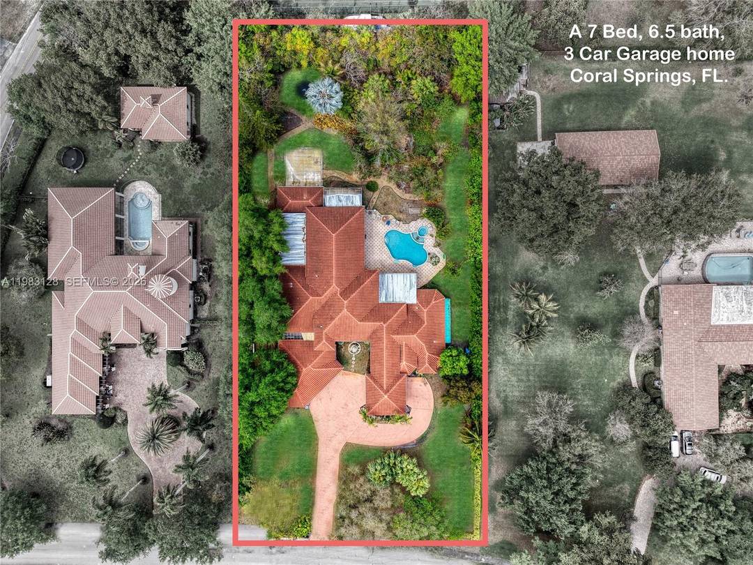 Welcome to this exceptional private estate in the prestigious Hills of Coral Springs, set on over an acre of beautifully landscaped grounds offering space, privacy, and a true resort style ...