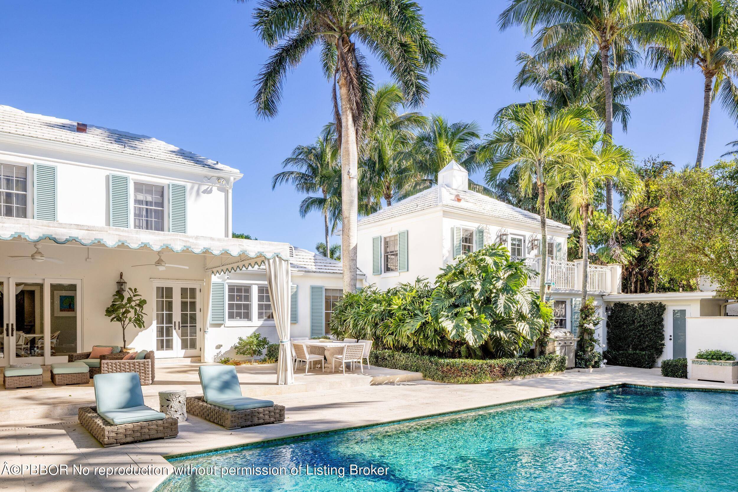 Gorgeously remodeled Monterey Colonial home designed by renowned Palm Beach architect John Volk.