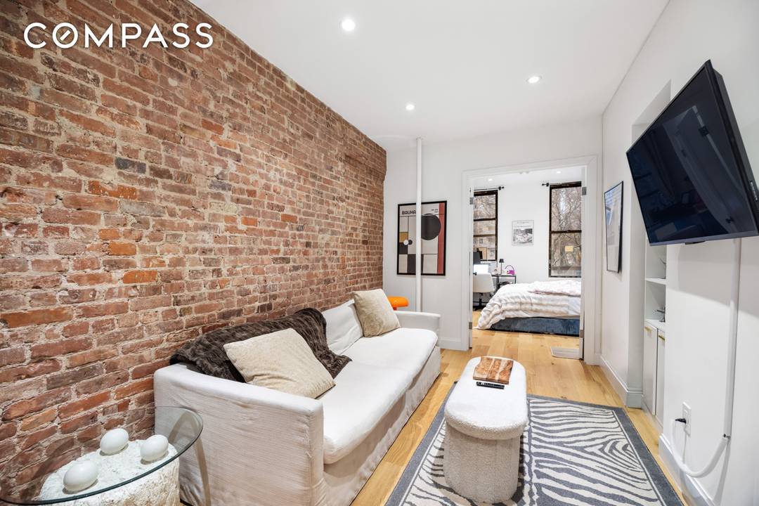 Welcome to 347 East 5th Street, Apartment 1A a move in ready two bedroom sponsor unit that perfectly blends East Village charm with modern convenience.