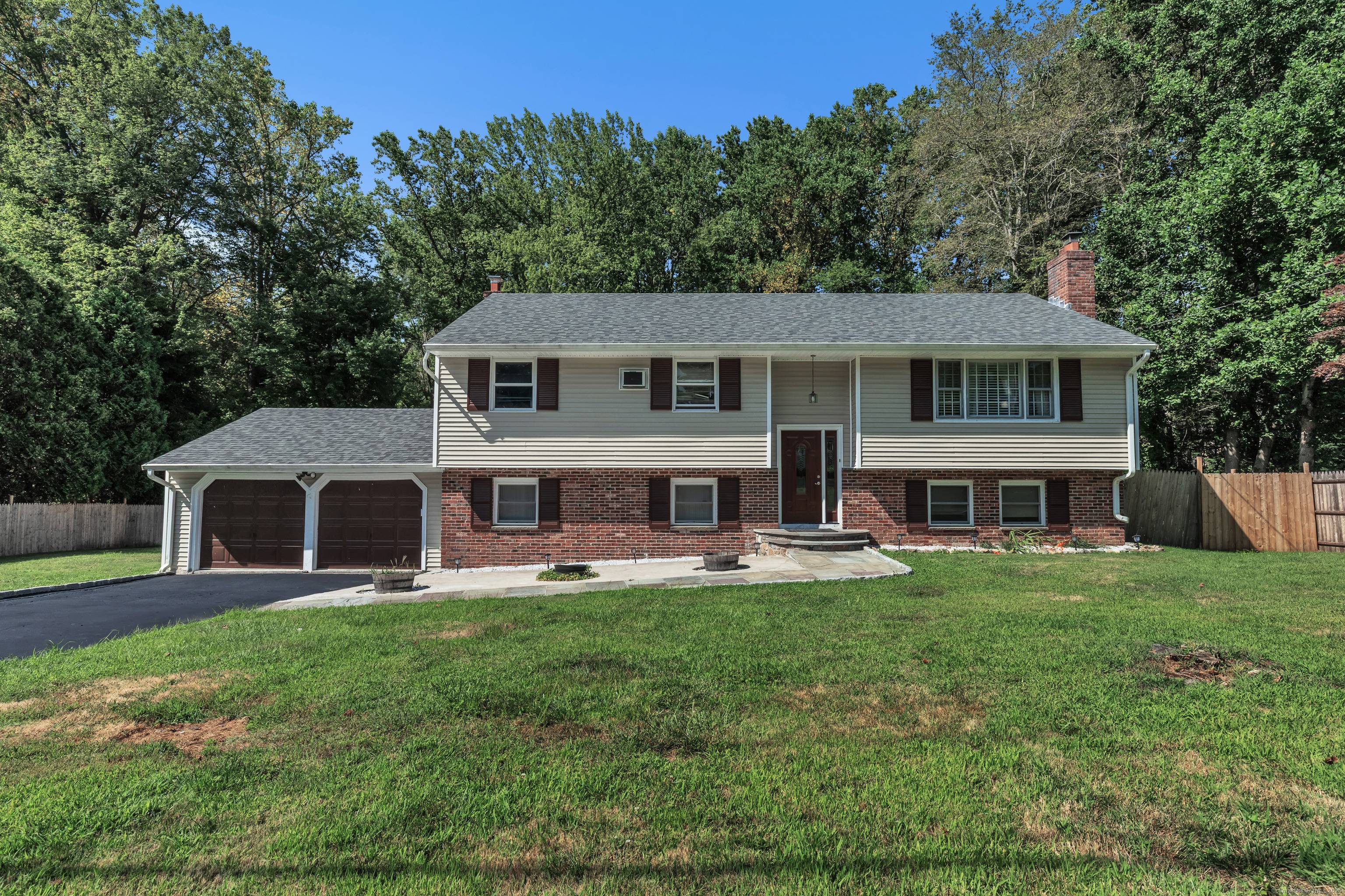 Welcome to this beautifully maintained raised ranch nestled in a quiet residential neighborhood in desirable Trumbull.