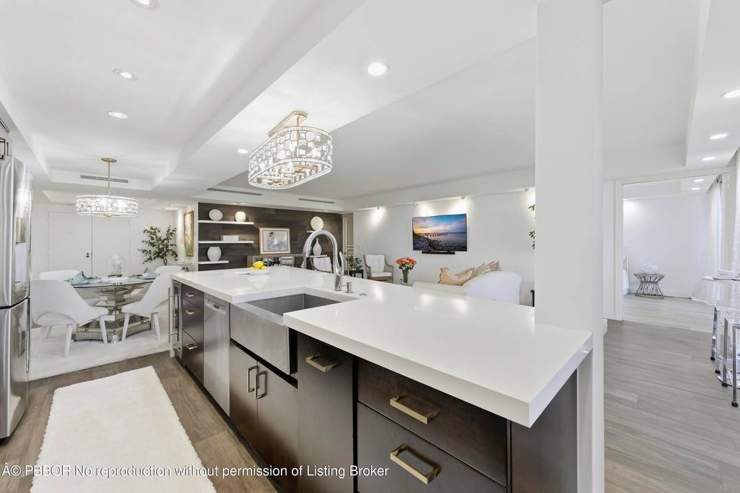 Step into refined coastal elegance with this impeccably renovated two bedroom, two and a half bath residence located in one of Palm Beach's most coveted full amenity buildings.