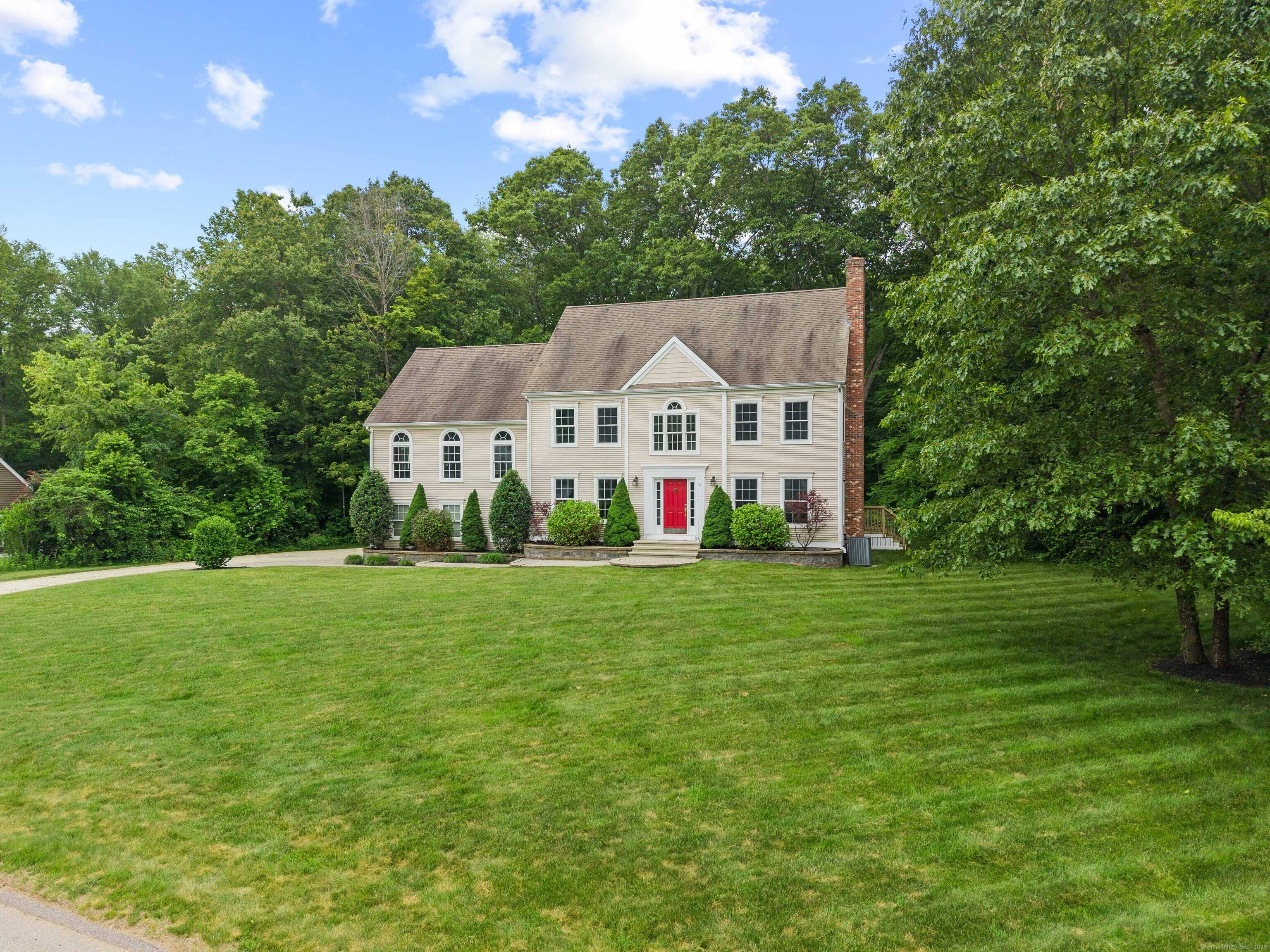 Welcome to this stately Colonial nestled on over an acre in a peaceful cul de sac neighborhood.