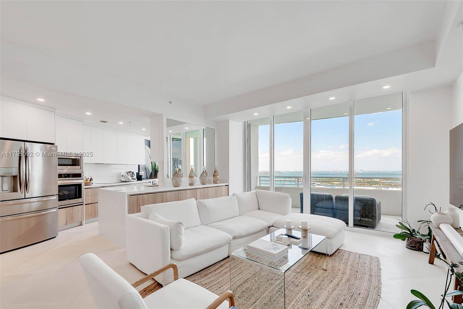 This exceptional waterfront residence, located on one of the Pre Penthouse floors, offers breath taking water and skyline views that greet you the moment you open the door.