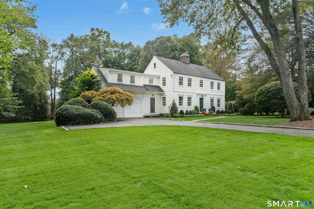This gracious Colonial blends timeless 1930s charm with thoughtful modern updates, ideally located on one of Darien's most sought after in town streets, known for its traditions and strong sense ...