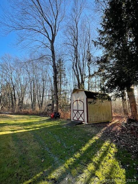 Raised ranch with new kitchen, new Anderson windows, newer roof, tile and hardwood floors throughout main level and riverstone fireplace located on very quiet street.