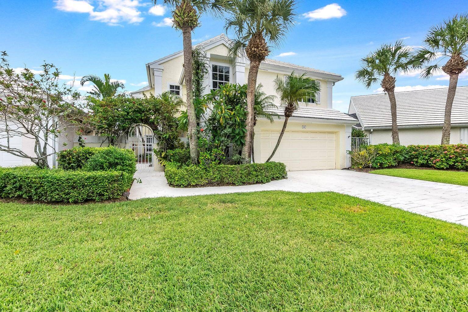 Welcome to 23 Windsor Lane, an exquisite residence nestled within the prestigious Palm Beach Gardens.