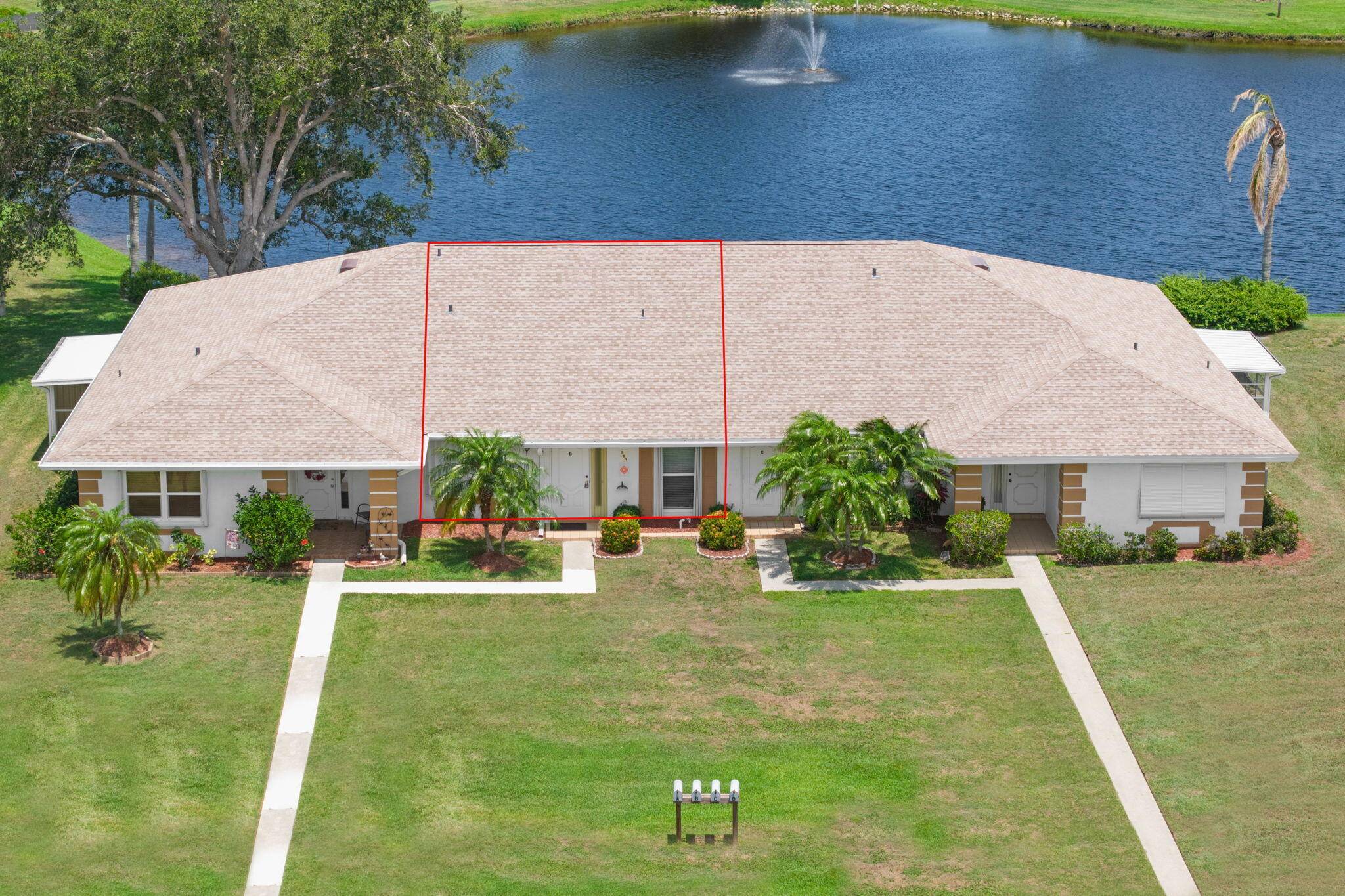 Much sought after lakefront location with a view of the lake fountain from living areas FL RM.
