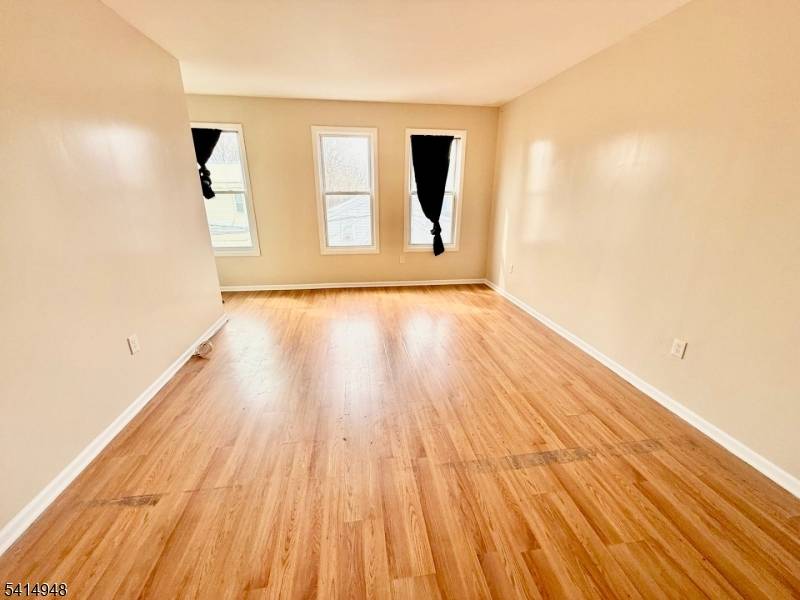 Fully renovated in 2020, this spacious and bright three family home is located in a rapidly growing area and offers an excellent opportunity for both investors and owner occupants.