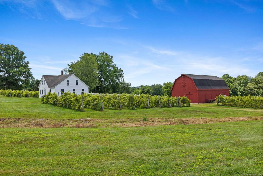 Step into the heart of New England's storied past with this exceptional property located directly across from the picturesque Lebanon Town Green.