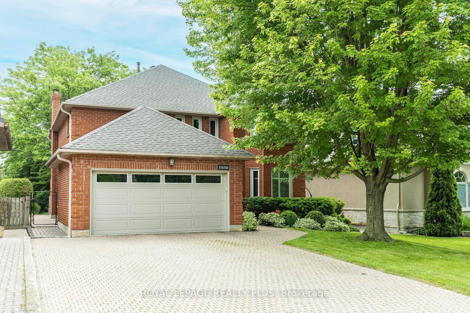 This elegant home built by Belsito has a magnificent 200' landscaped lot designed by Sheridan Nurseries.