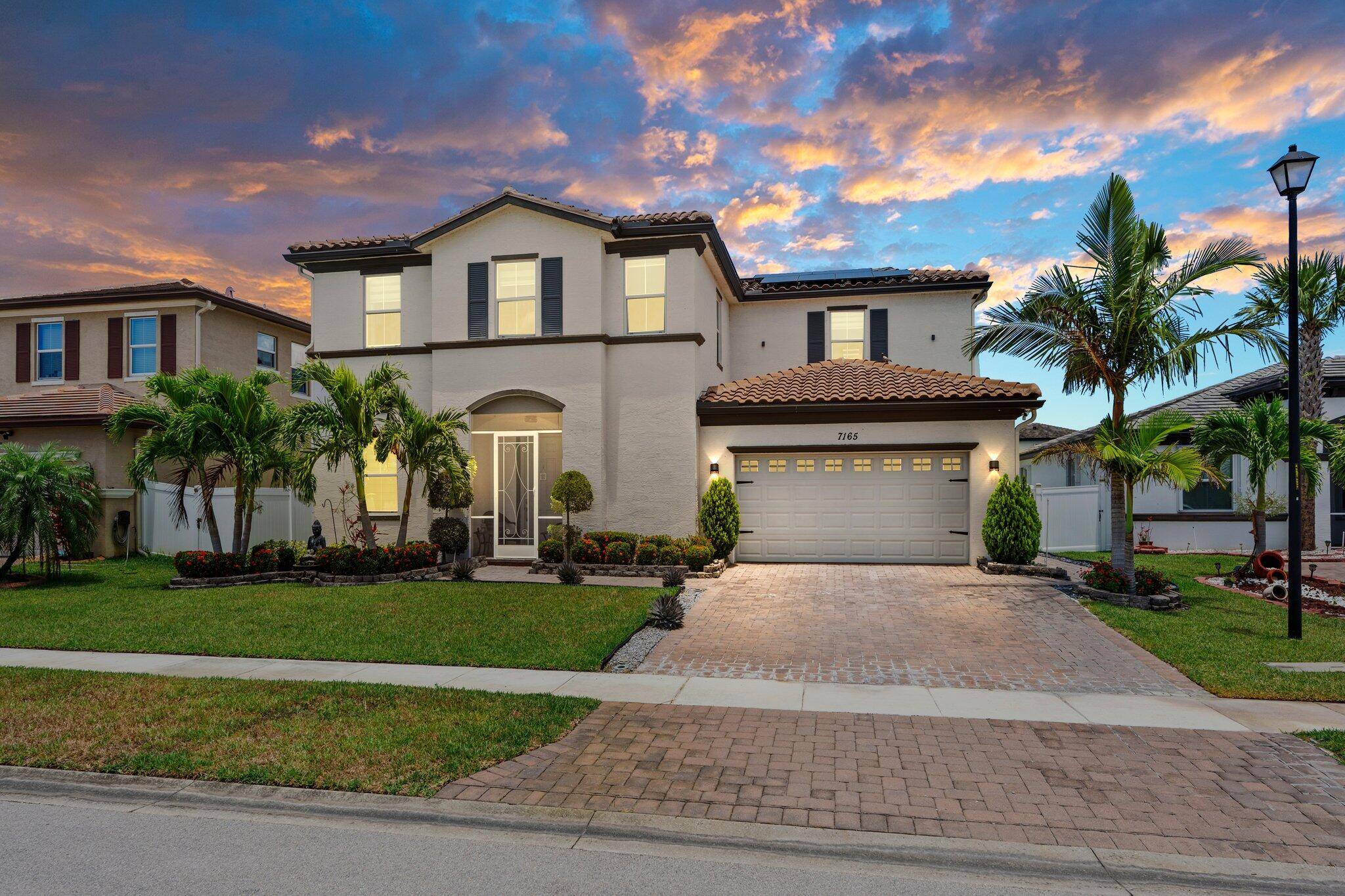 Look at this Heated, Salt Water Pool featuring a hot tub, extended covered patio with custom diamond pavers !