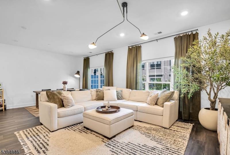 Welcome to 68 Harvest Way, a stylish two story townhome nestled within The Parke at Little Falls.