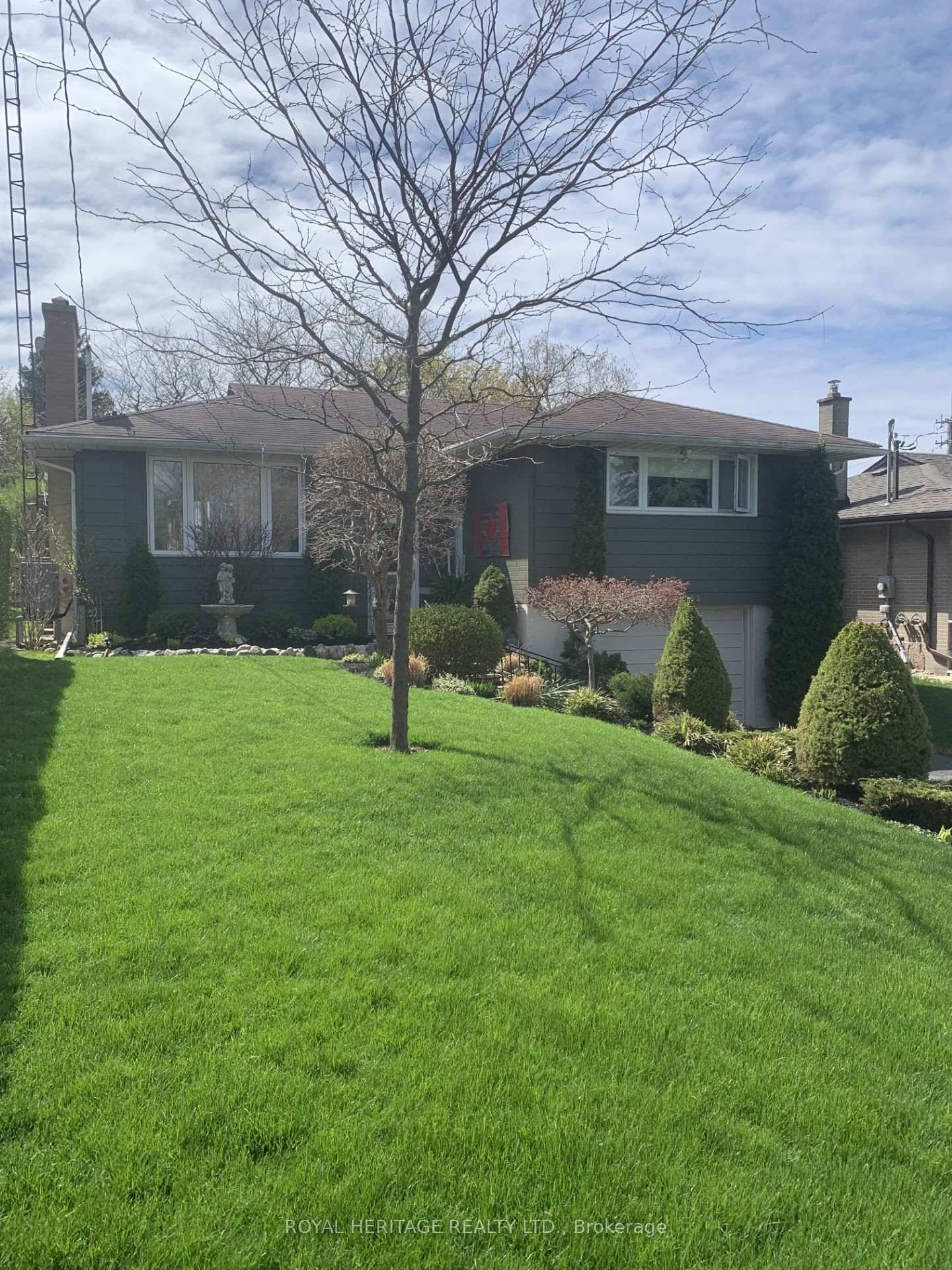 Well maintained bungalow on a large 50X100 beautifully landscaped lot.