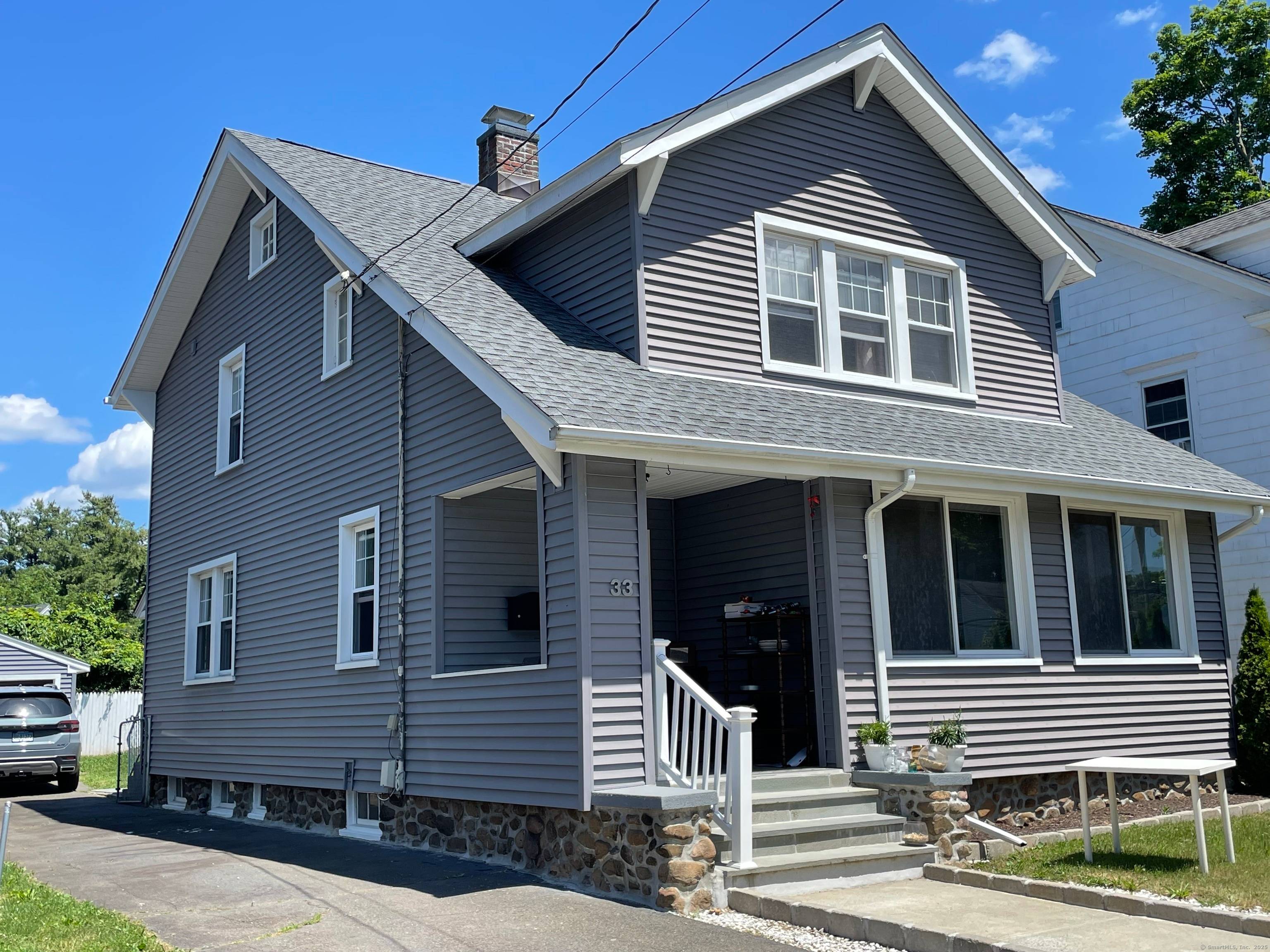 Spacious Arts Crafts home with new kitchen and 2 new full baths ; HW floors throughout ; entry foyer with Fr.