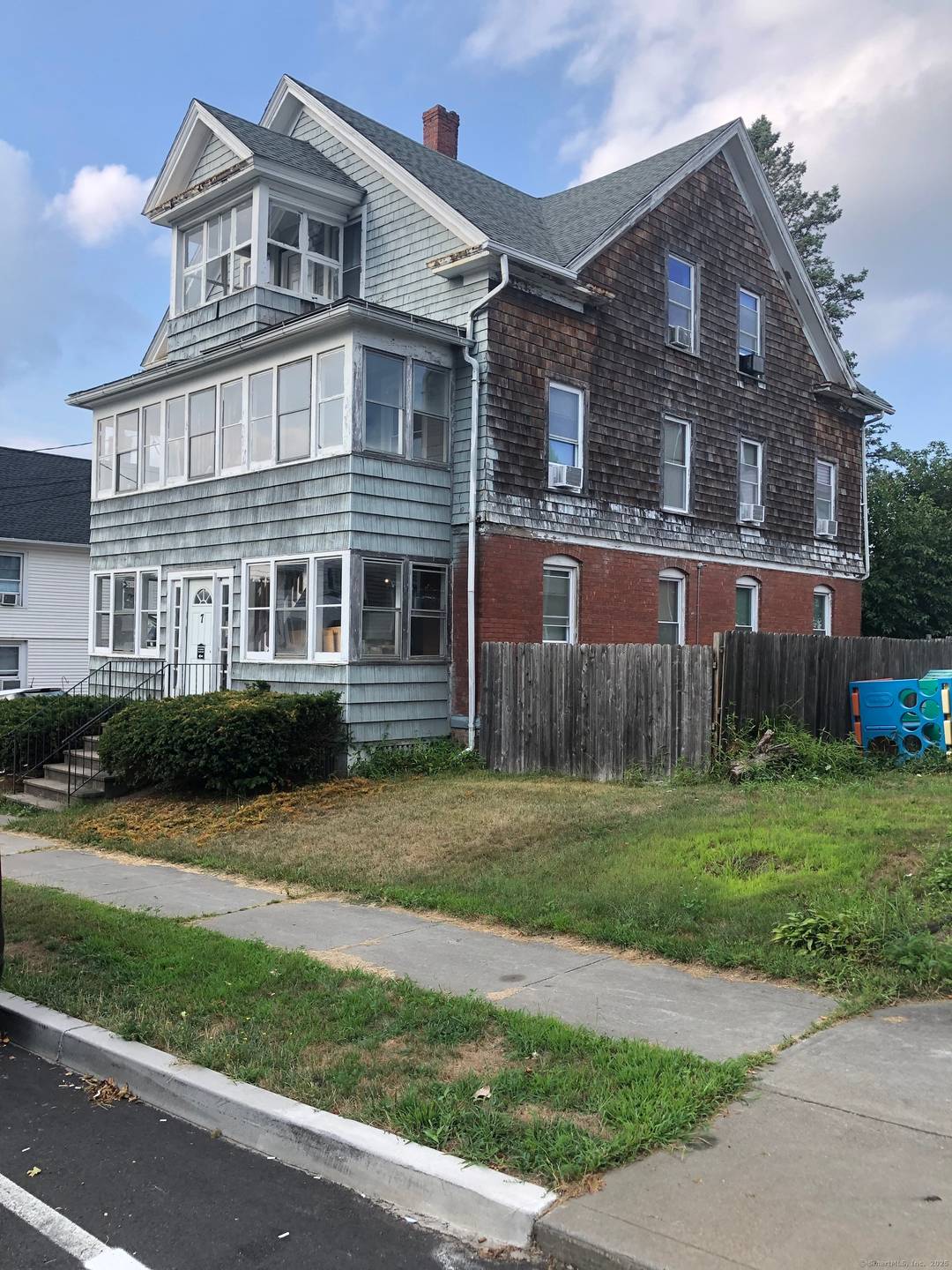 Fully Leased Three Family.