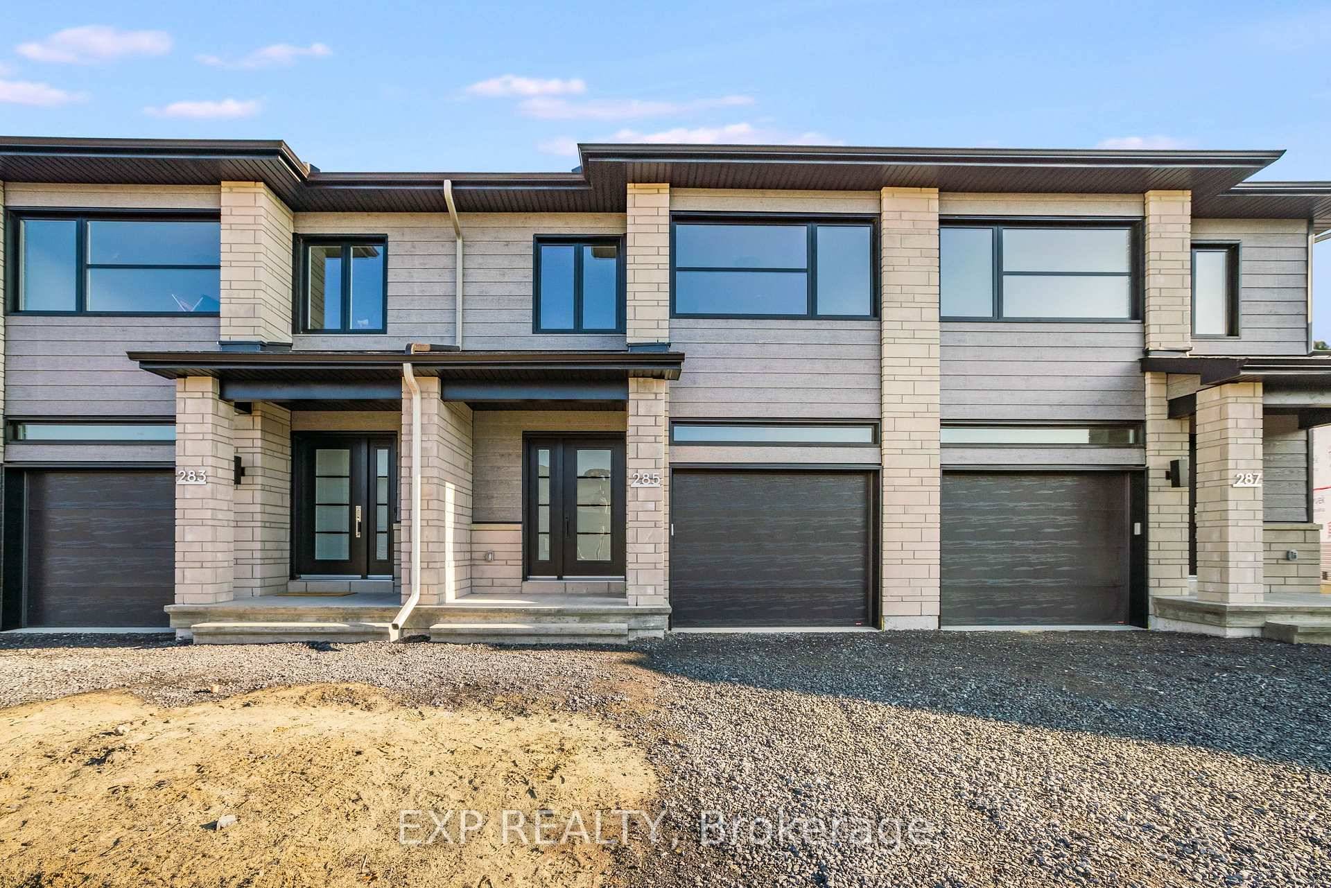 Welcome to White Rock middle unit, a gorgeous townhome on a premium lot featuring a bright open concept layout with a chef's kitchen including an island and walk in pantry.