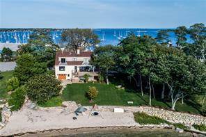 Gorgeous 4 bedroom, 3 bath elegant home sits on a beautifully landscaped waterfront lot on a secluded peninsula with two private white sandy beaches steps from the house.