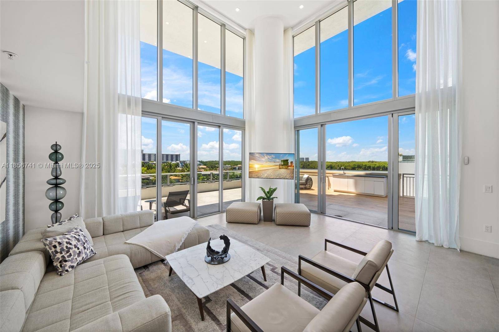 One of a kind, two level corner residence where light filled interiors meet sleek modern design, and floor to ceiling windows frame incredible water views from every room.