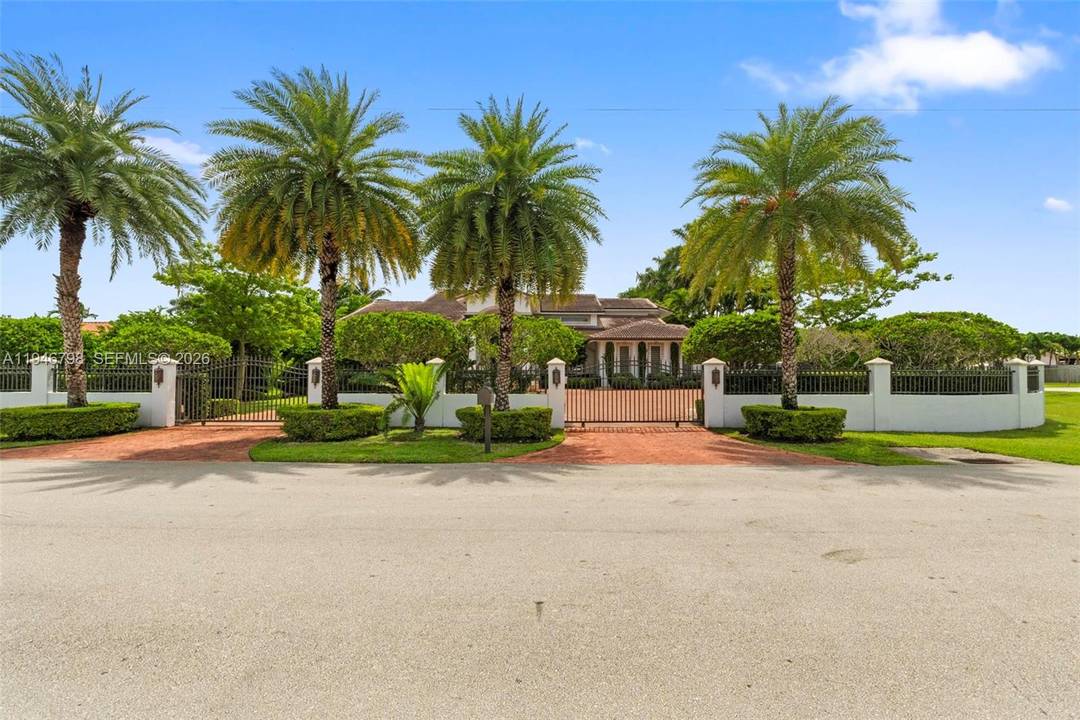 Stunning two story estate in Miami on nearly an acre, featuring a European style main house and a modern guest house.