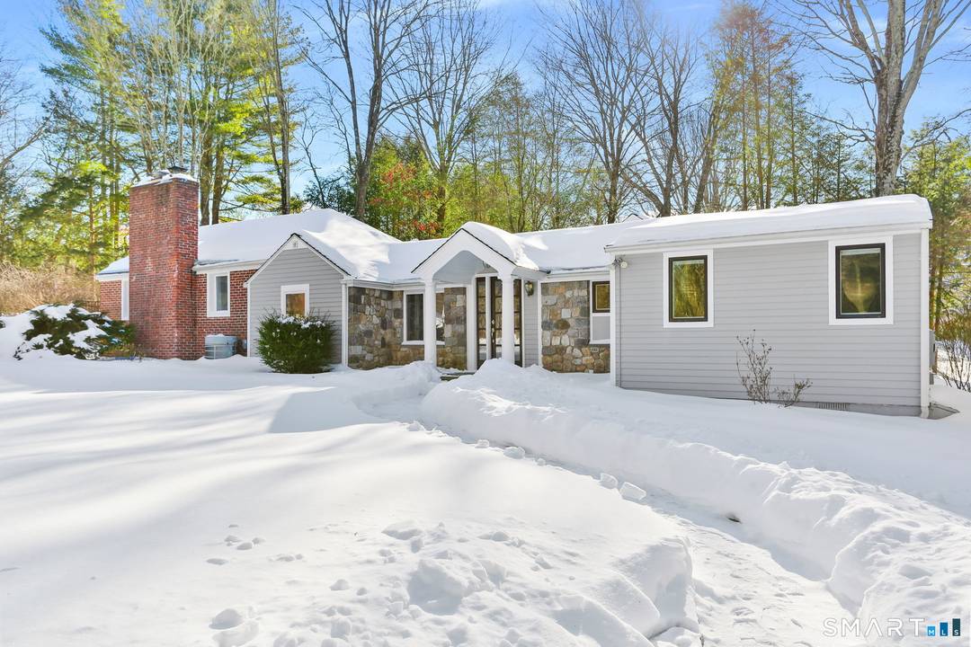 Set on beautifully landscaped grounds, this refined transitional ranch offers a rare blend of style, functionality, and flexibility.