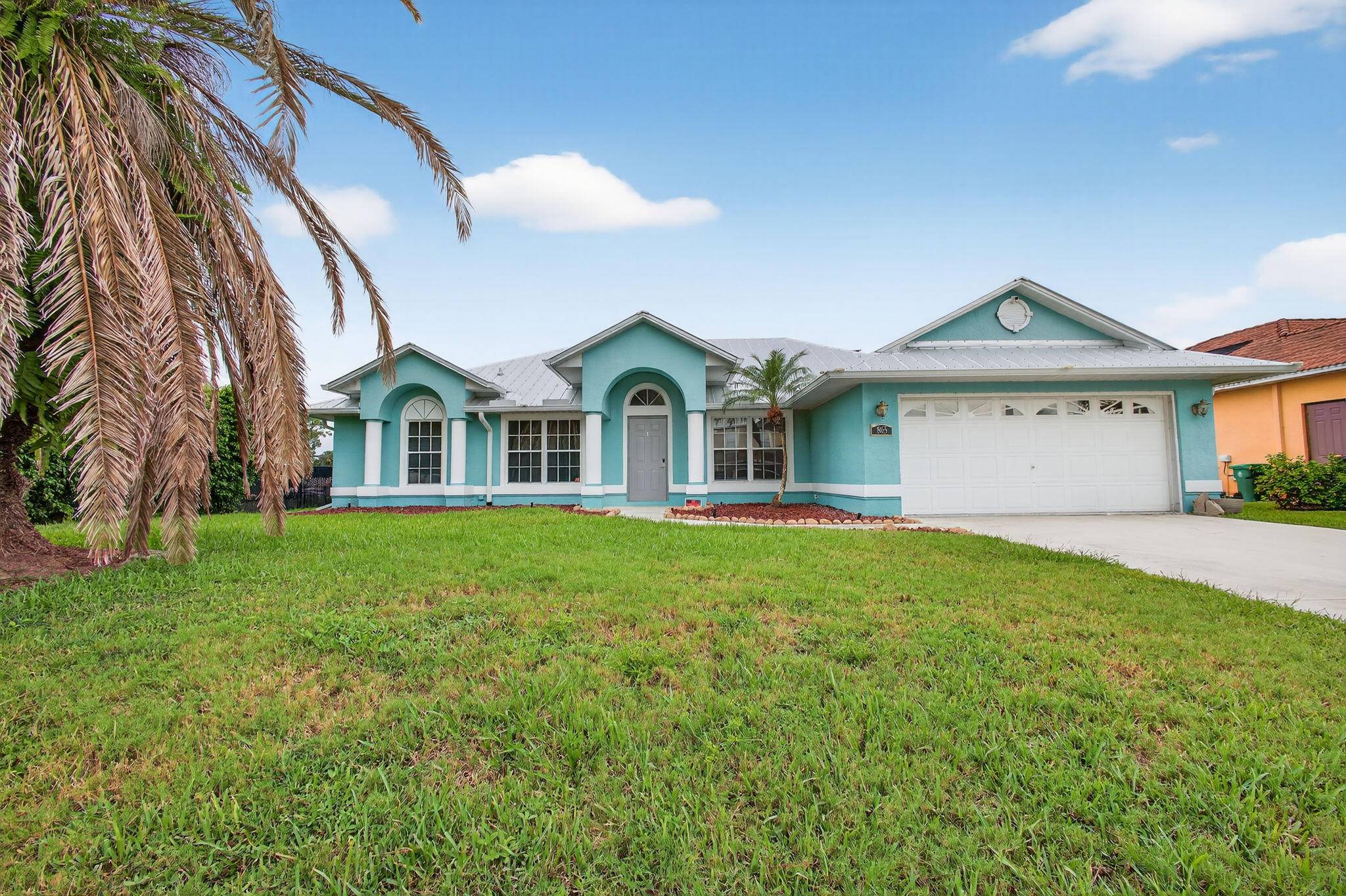 An incredible open concept CBS home with tall ceilings, split floor plan, dedicated office den area, newer metal roof, and it backs to a beautiful canal which can have a ...